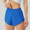Luluwomen – Shorts de sport respirants et amples pour femmes, 2.5 pouces, poches latérales, sous-vêtements de course, de Fitness et de Yoga, à séchage rapide