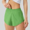 Luluwomen – Shorts de sport respirants et amples pour femmes, 2.5 pouces, poches latérales, sous-vêtements de course, de Fitness et de Yoga, à séchage rapide