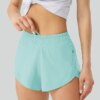 Luluwomen – Shorts de sport respirants et amples pour femmes, 2.5 pouces, poches latérales, sous-vêtements de course, de Fitness et de Yoga, à séchage rapide